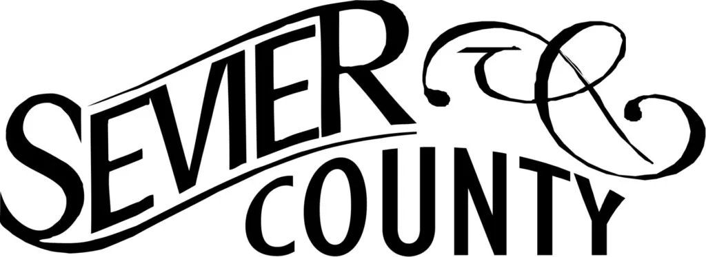 Sevier County logo with stylized text and decorative flourish